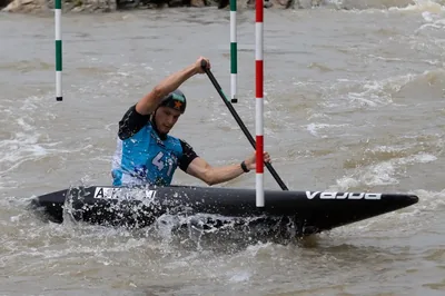 Kayaker paddling through water