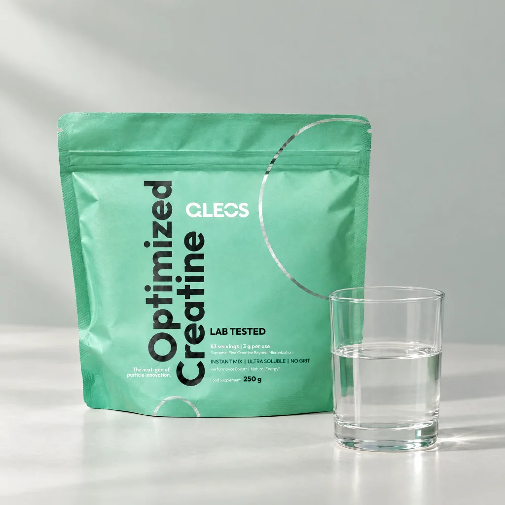 Editorial still life of Optimized Creatine and a glass of water
